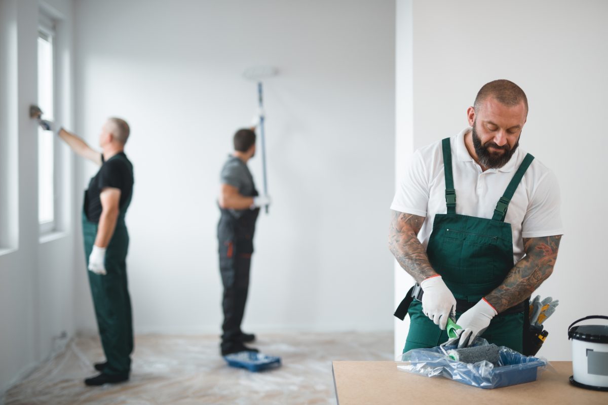 Builder preparing to paint the apartment during renovation